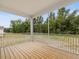 Relaxing screened porch overlooking lush green foliage, perfect for enjoying the outdoors in comfort at 138 Alden Way, Angier, NC 27501