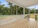 Inviting screened porch with wood flooring and a scenic view of a private backyard, ideal for entertaining at 138 Alden Way, Angier, NC 27501