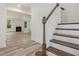 Staircase with a view of the living room and fireplace at 138 Alden Way, Angier, NC 27501