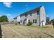 Large, fenced backyard with solar panels, patio and a lush grassy area at 138 Horizon Trl, Garner, NC 27529