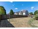 Large grassy backyard surrounded by a wood privacy fence at 138 Horizon Trl, Garner, NC 27529