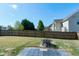 Large, fenced backyard with fire pit and patio area at 138 Horizon Trl, Garner, NC 27529
