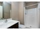 The bathroom has a shower, toilet, and sink with dark wood cabinets at 138 Horizon Trl, Garner, NC 27529