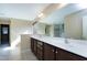 Bathroom featuring a double sink vanity, large mirror, and natural light from window at 138 Horizon Trl, Garner, NC 27529