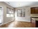 Charming breakfast nook bathed in natural light, featuring wood floors and classic window blinds at 138 Horizon Trl, Garner, NC 27529
