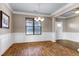 Bright dining room features hardwood floors, wainscoting, and a decorative chandelier at 138 Horizon Trl, Garner, NC 27529