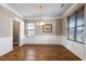 Bright dining room featuring wainscoting, modern lighting fixture and large windows at 138 Horizon Trl, Garner, NC 27529