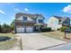 Charming home featuring a stone facade and a spacious driveway at 138 Horizon Trl, Garner, NC 27529