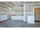 Unfinished garage features built-in storage cabinets and shelving for organization at 138 Horizon Trl, Garner, NC 27529