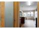 View of the modern kitchen through the pantry door with lots of natural light at 138 Horizon Trl, Garner, NC 27529