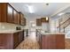 Modern kitchen with a center island, granite countertops, stainless steel appliances, and hardwood floors at 138 Horizon Trl, Garner, NC 27529