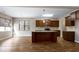 Spacious kitchen features a center island, dark wood cabinets, and stainless steel appliances at 138 Horizon Trl, Garner, NC 27529