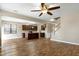 Open-concept living space showcasing hardwood floors, kitchen, and staircase at 138 Horizon Trl, Garner, NC 27529