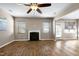 Spacious living room with a fireplace, hardwood floors, and plenty of natural light at 138 Horizon Trl, Garner, NC 27529
