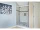 Bathroom featuring a modern tiled shower with built in shelves and mosaic tile floor at 138 Horizon Trl, Garner, NC 27529