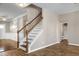 Staircase with hardwood floors leading to the upper level, with bathroom view at 138 Horizon Trl, Garner, NC 27529