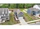 Aerial view of the home, showcasing the surrounding neighborhood and nearby pond at 1501 Addison Lake St, Fuquay Varina, NC 27526