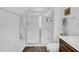 Bathroom featuring walk in shower, tile flooring, a linen closet, white walls and a dark vanity at 1501 Addison Lake St, Fuquay Varina, NC 27526