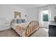 Cozy bedroom featuring light carpet, bright window, and comfortable furnishings at 1501 Addison Lake St, Fuquay Varina, NC 27526