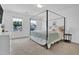 Spacious primary bedroom featuring lots of natural light, a decorative bed frame and neutral carpet at 1501 Addison Lake St, Fuquay Varina, NC 27526