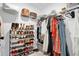 Walk-in closet with shoe racks and hanging space for organizing clothes and accessories at 1501 Addison Lake St, Fuquay Varina, NC 27526