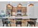 Stylish kitchen with a white quartz countertop island, stainless steel appliances and pendant lighting at 1501 Addison Lake St, Fuquay Varina, NC 27526