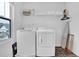 Bright laundry room with new washer and dryer, window, and plenty of storage space at 1501 Addison Lake St, Fuquay Varina, NC 27526