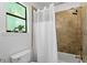 Modern bathroom featuring a shower and bathtub combination with tiled walls and contemporary fixtures at 158 Poplar St # A, Chapel Hill, NC 27516