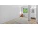Well-lit bedroom with neutral carpet, a window for natural light, and access to an ensuite bathroom at 158 Poplar St # A, Chapel Hill, NC 27516
