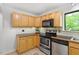 Kitchen featuring stainless steel appliances and wooden cabinets at 158 Poplar St # A, Chapel Hill, NC 27516