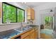 Kitchen featuring stainless steel sink, and wooden cabinets at 158 Poplar St # A, Chapel Hill, NC 27516