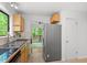 Bright kitchen featuring stainless steel appliances and a large window with views of the outdoors at 158 Poplar St # A, Chapel Hill, NC 27516