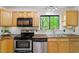 Kitchen featuring stainless steel appliances and wooden cabinets at 158 Poplar St # A, Chapel Hill, NC 27516