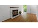 Living room featuring a fireplace and hardwood floors at 158 Poplar St # A, Chapel Hill, NC 27516