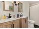Modern bathroom features double sinks, framed mirrors, stylish lighting, and a patterned shower curtain at 1636 Cone Ave, Apex, NC 27502