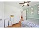 A cheerful room with wooden floors and a white dresser beside a blue-green wall at 1636 Cone Ave, Apex, NC 27502