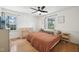 Bright bedroom with hardwood floors, comfortable bed, dresser, and natural light at 1636 Cone Ave, Apex, NC 27502