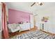 A sweet Bedroom with a rocking chair, dresser, and charming decor at 1636 Cone Ave, Apex, NC 27502