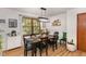 Cozy dining area with modern lighting, hardwood floors, and ample natural light at 1636 Cone Ave, Apex, NC 27502