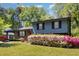 Charming two-story home with lush landscaping, brick accents and inviting curb appeal at 1636 Cone Ave, Apex, NC 27502