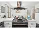 Kitchen counter and gas range with view to dining area at 1636 Cone Ave, Apex, NC 27502