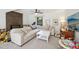 Bright living room featuring a fireplace, plush sectional sofa, and a large window at 1636 Cone Ave, Apex, NC 27502