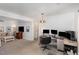 Spacious living room with an office area and comfortable seating with stylish decor elements at 1636 Cone Ave, Apex, NC 27502