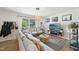 Cozy living room with neutral-toned furnishings, natural light, and stylish decor at 1636 Cone Ave, Apex, NC 27502
