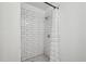 Clean and bright tiled shower featuring subway tiles and a rainfall shower head at 1636 Cone Ave, Apex, NC 27502