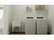 Well-lit laundry room with modern washer and dryer, complemented by a utility sink at 1645 Goldfinch Perch Ln, Knightdale, NC 27545
