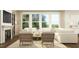 Cozy living room with a fireplace, plush sofa, decorative pillows, and lots of natural light at 1645 Goldfinch Perch Ln, Knightdale, NC 27545