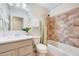 Full bathroom includes a tub, shower, and a large vanity with modern fixtures at 1715 Us 15-501 S, Chapel Hill, NC 27517