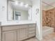 Bathroom with large mirror, neutral countertops, and tiled bath and shower at 1715 Us 15-501 S, Chapel Hill, NC 27517