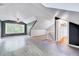 A spacious bonus room with gray vinyl floors, high ceilings, fan, and a closet at 1715 Us 15-501 S, Chapel Hill, NC 27517
